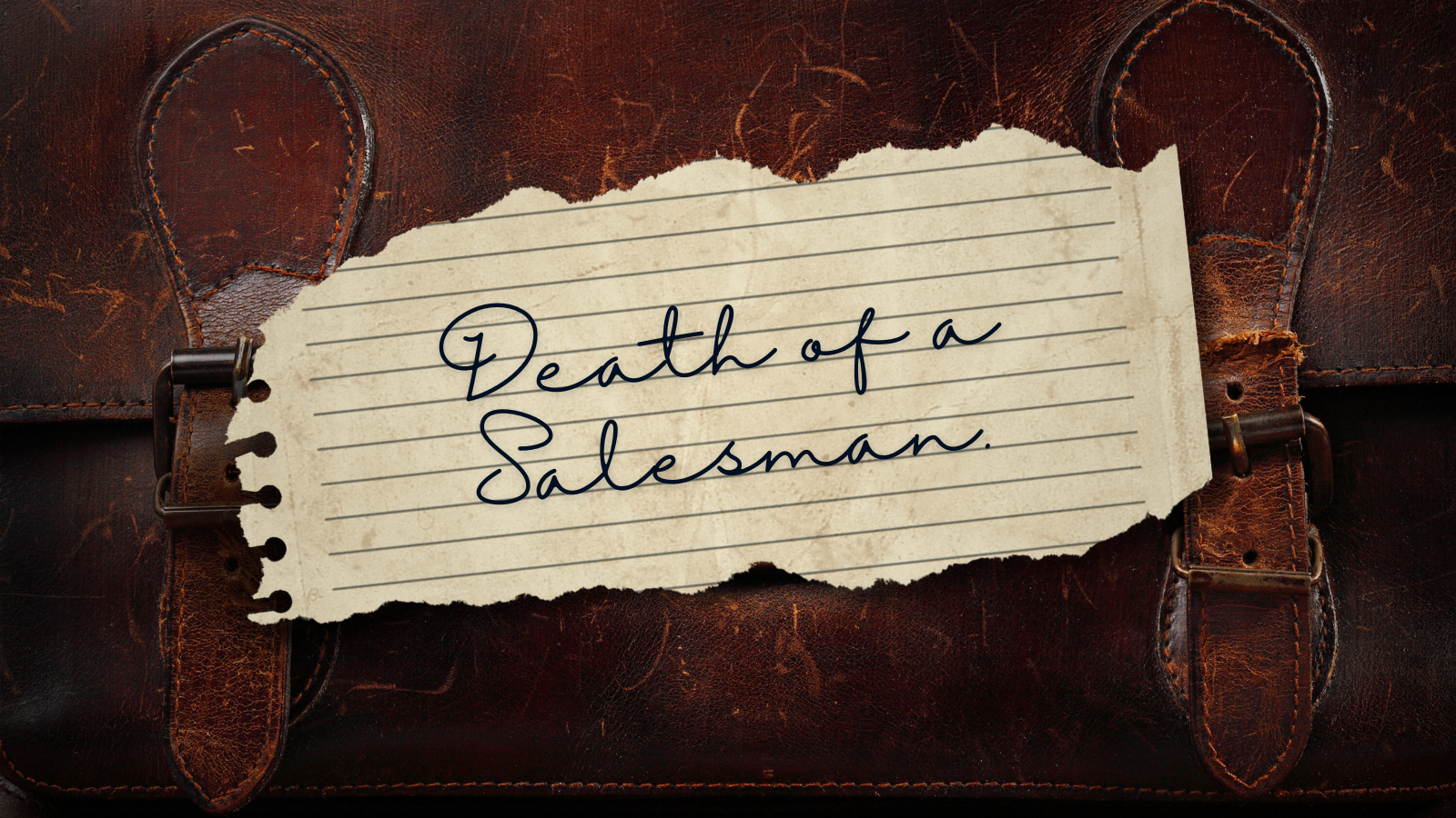 death of a salesman handwritten on a torn piece of paper sitting on an old brown leather briefcase