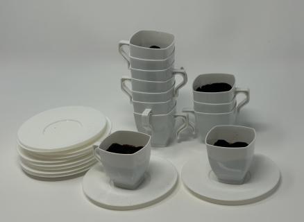Set of 12 espresso cups (insides painted brown) with saucers