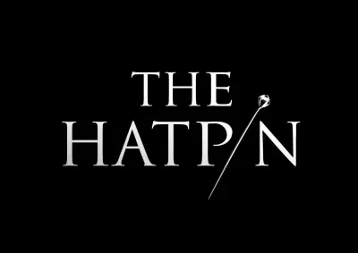 White text of "The Hatpin" on a black background. The i is replaced with an image of a hat pin.