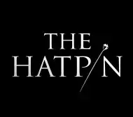 White text of "The Hatpin" on a black background. The i is replaced with an image of a hat pin.
