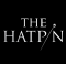 White text of "The Hatpin" on a black background. The i is replaced with an image of a hat pin.